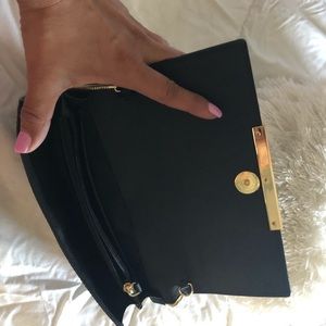 Black evening purse with gold strap